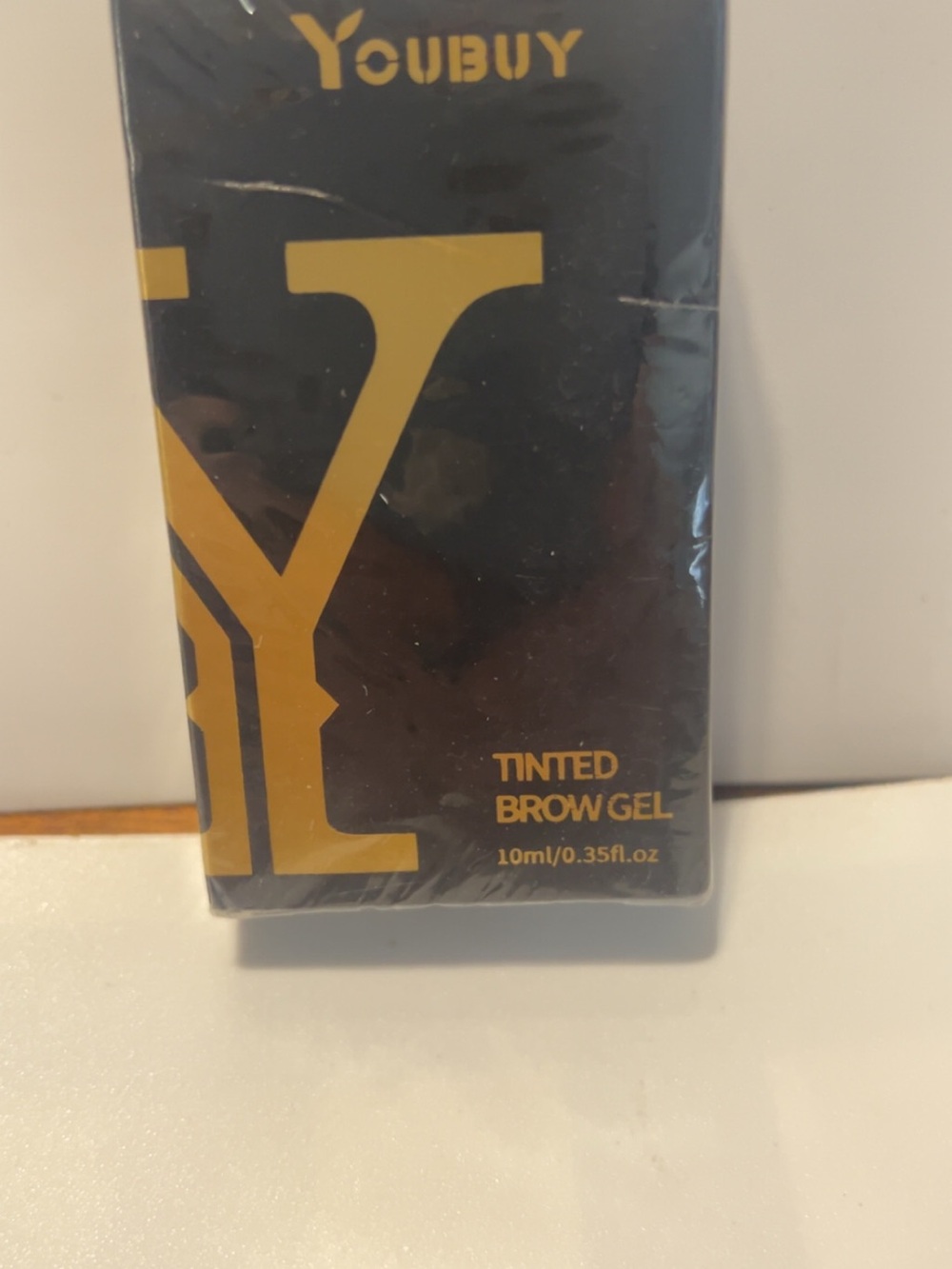 YOUBUY Tinted Brow Gel in Black and Gold Packaging